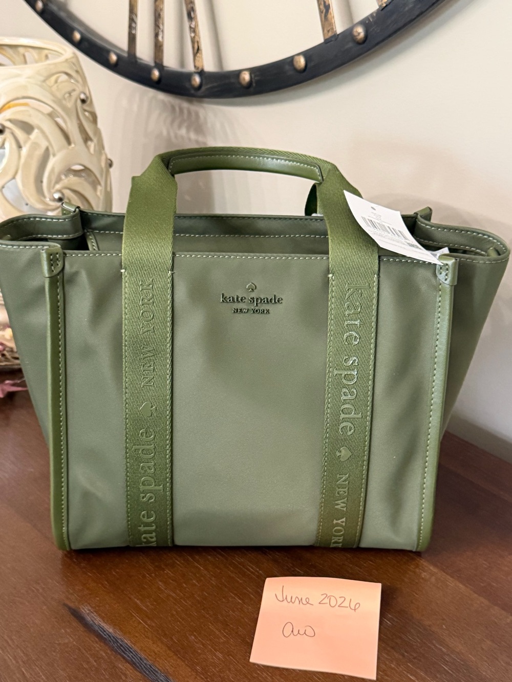 Kate spade olive green canvas tote with embossed straps. NWT   Crossbody strap.